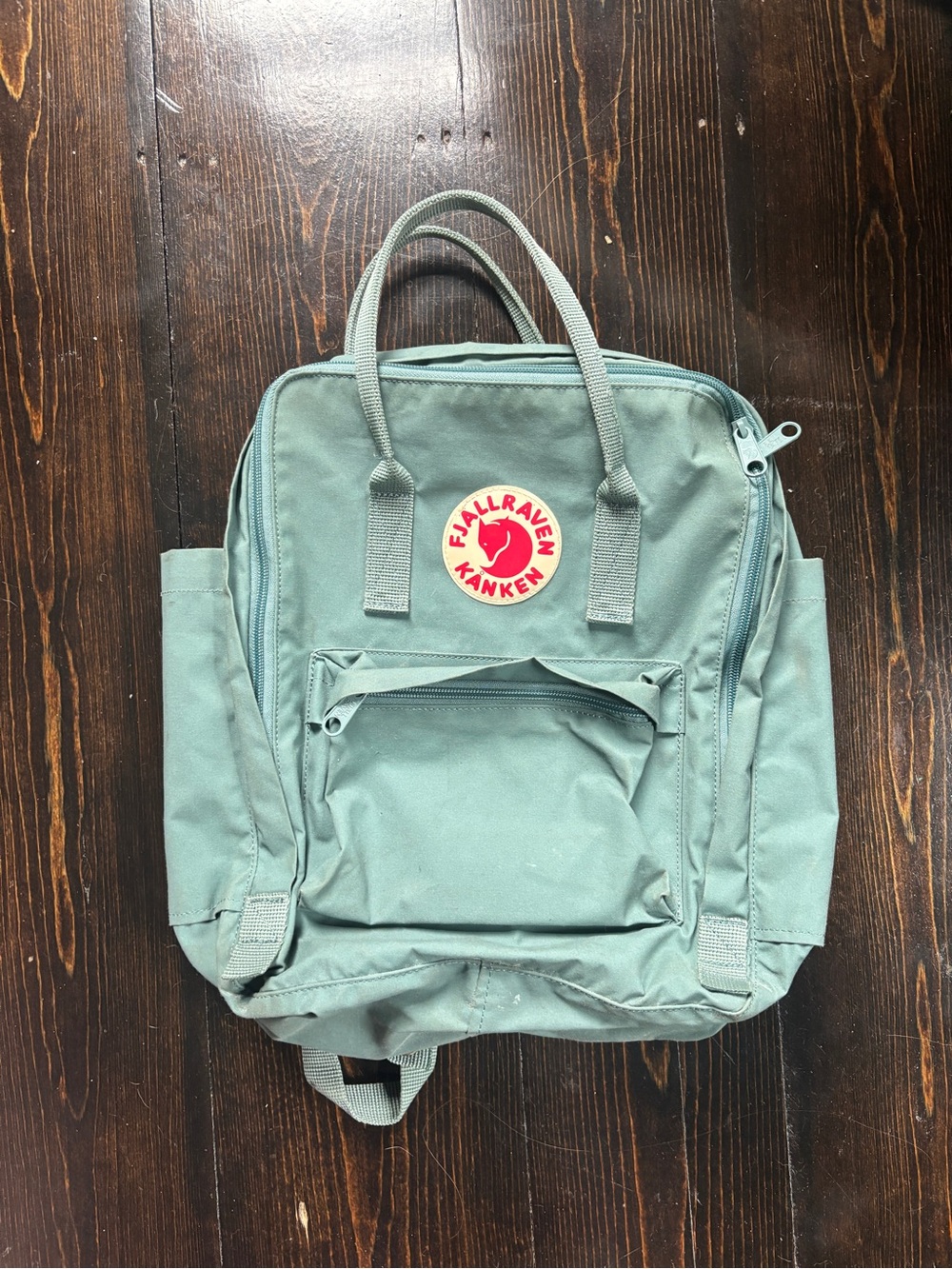 Fjallraven Kanken Backpack in Sage Green with Red Logo